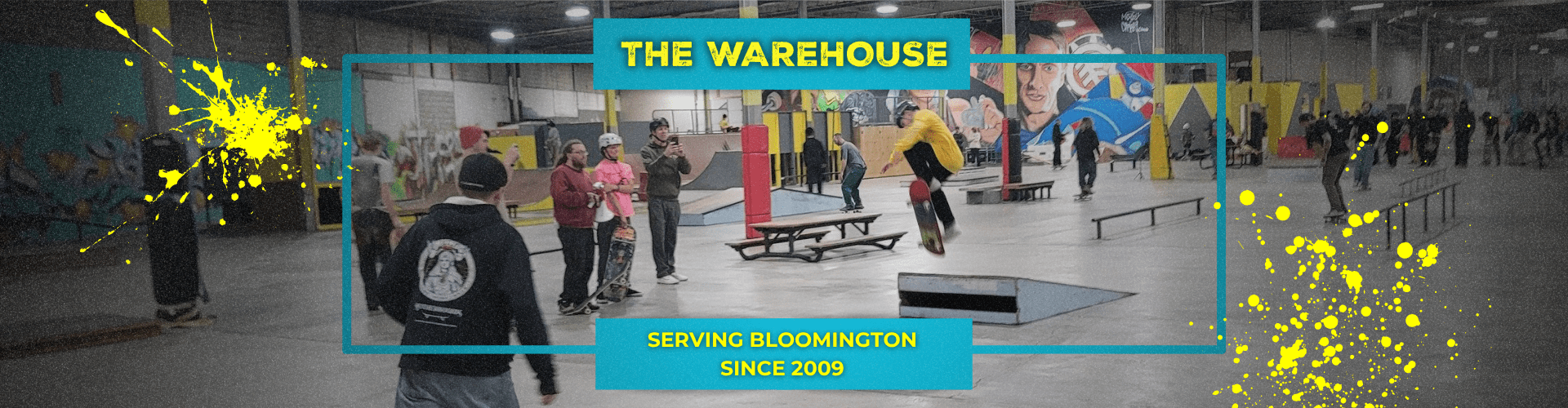 Panoramic view of The Warehouse skatepark featuring a center cyan-framed photo of a skateboarder landing a trick, cyan callout boxes reading "THE WAREHOUSE" and "SERVING BLOOMINGTON SINCE 2009", and vibrant yellow paint splatters.